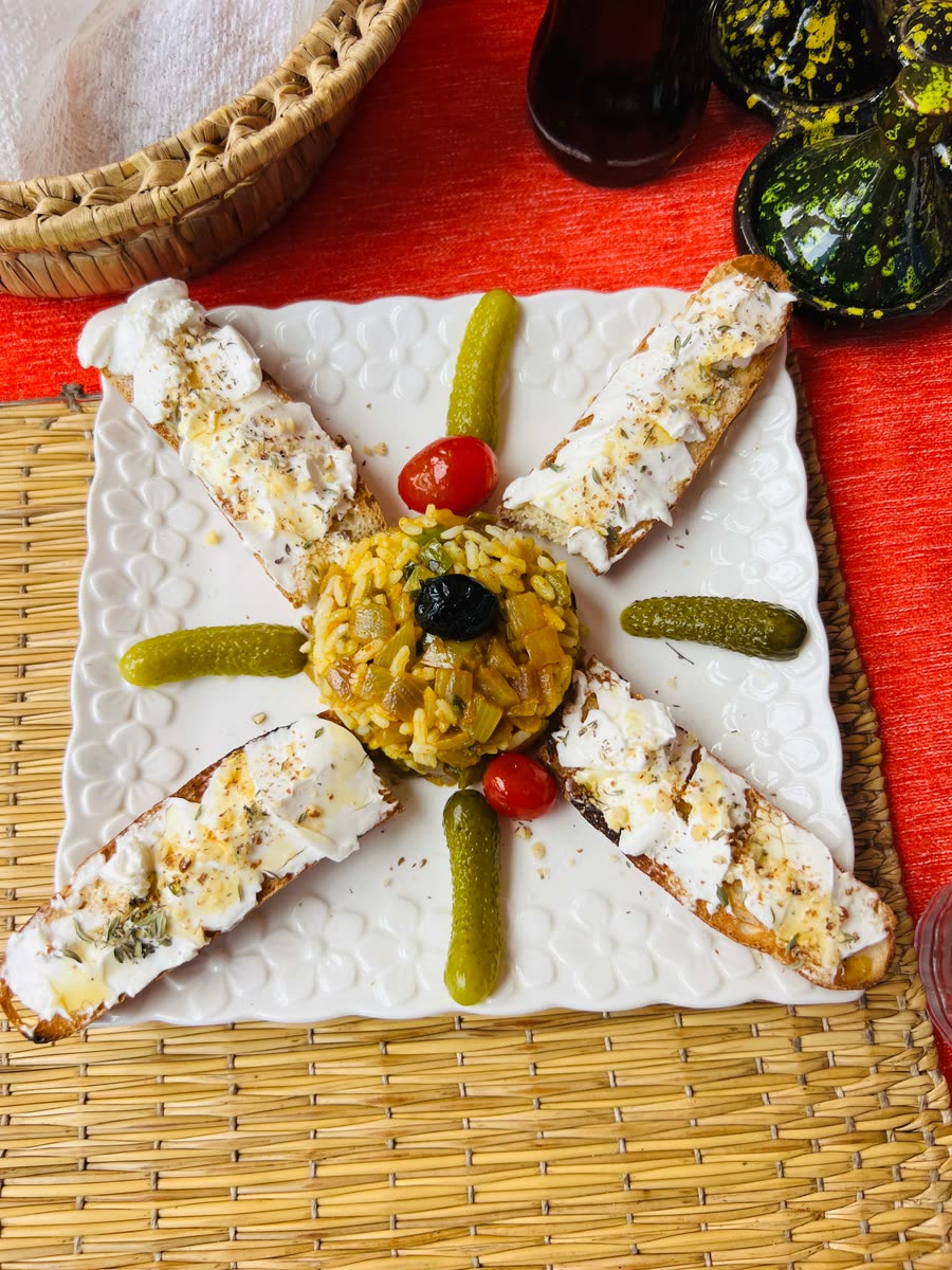 Moroccan cheese and herb bruschetta starter with rice and pickles, Restaurant Tayought Mirleft